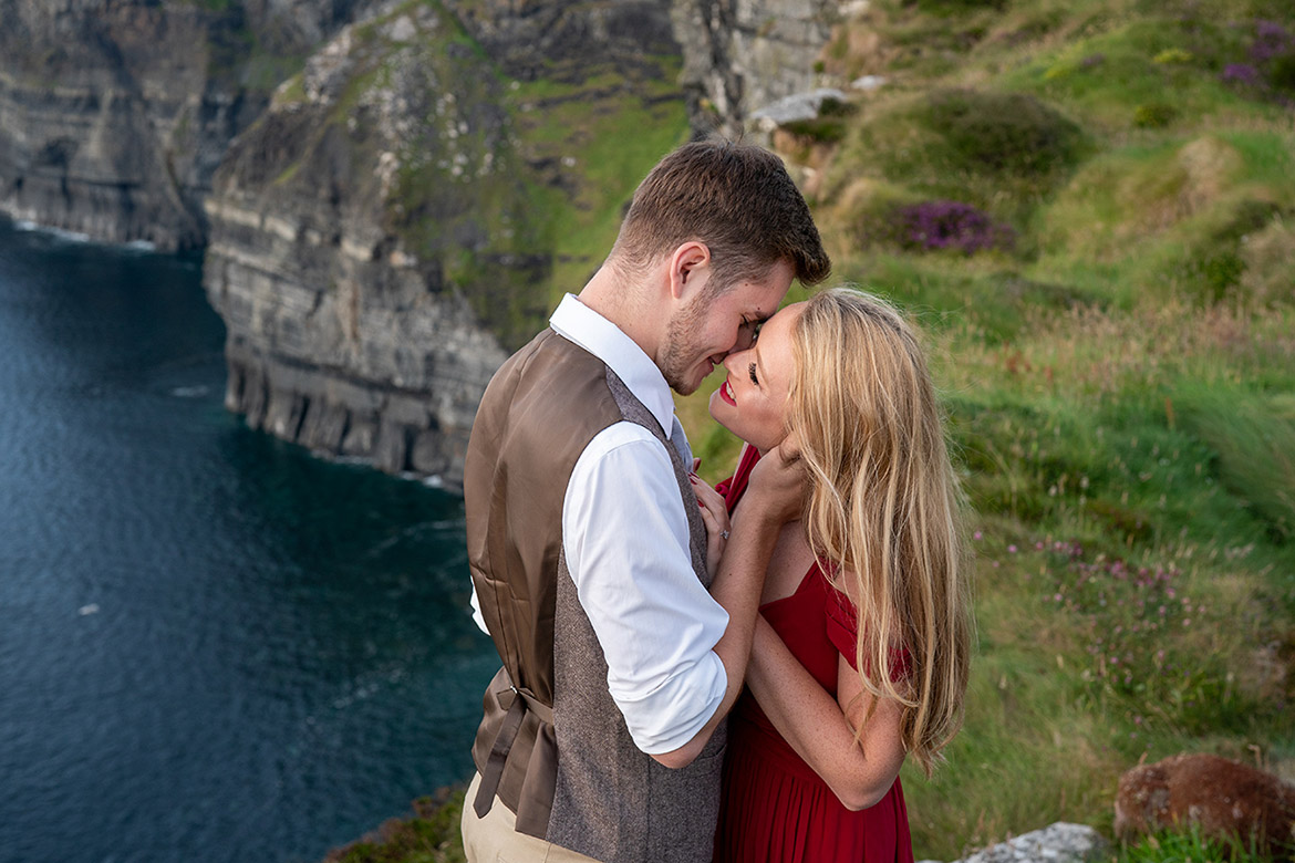 Engagement photo shoot overlooking the sea on the coast of ireland at the cliffs of Moher