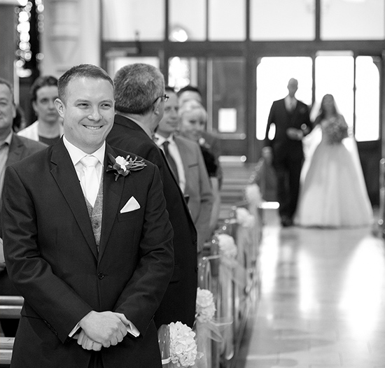 walking up the aisle grooms expression getting married wedding photography